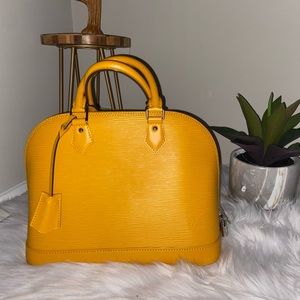 Pre loved Louis Vuitton Alma Epi leather.